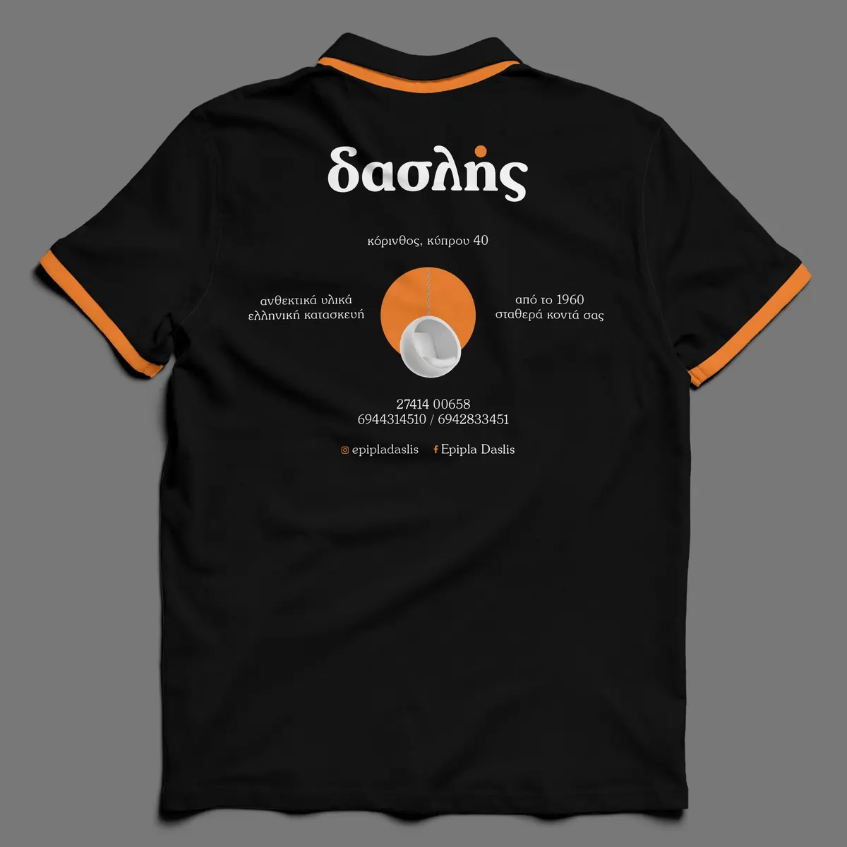 Back of the Daslis polo with orange trim, logo, address and phone numbers