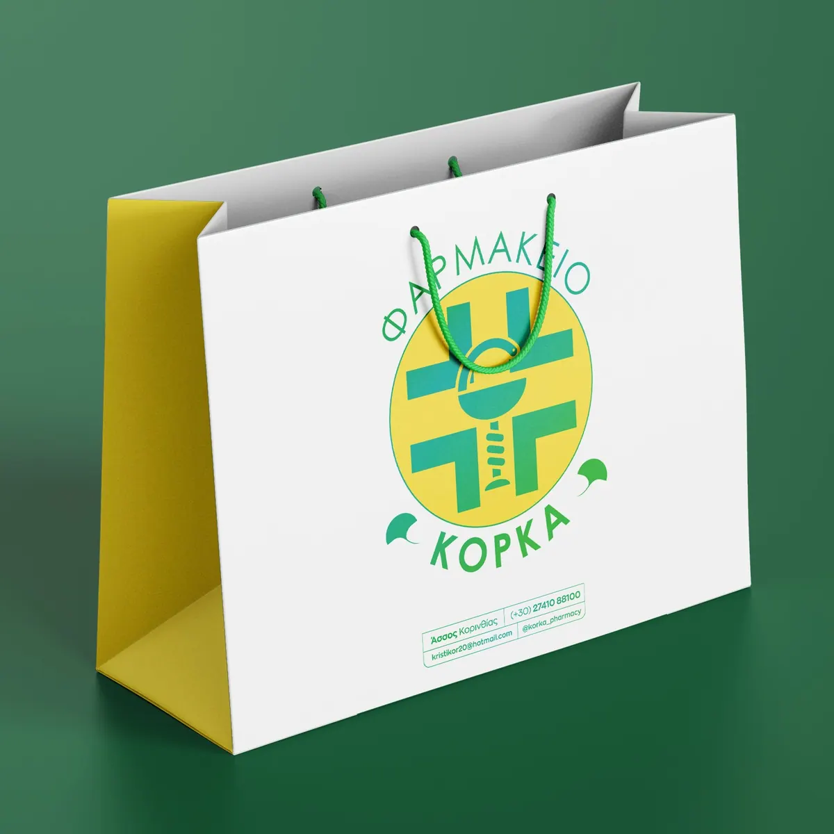 Paper shopping bag with the Korka Pharmacy logo
