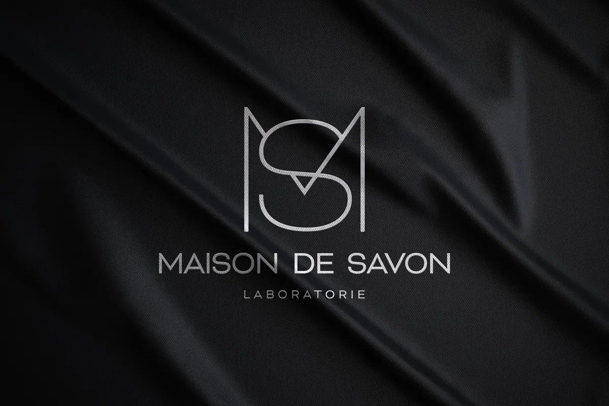 Maison de Savon monogram on black fabric