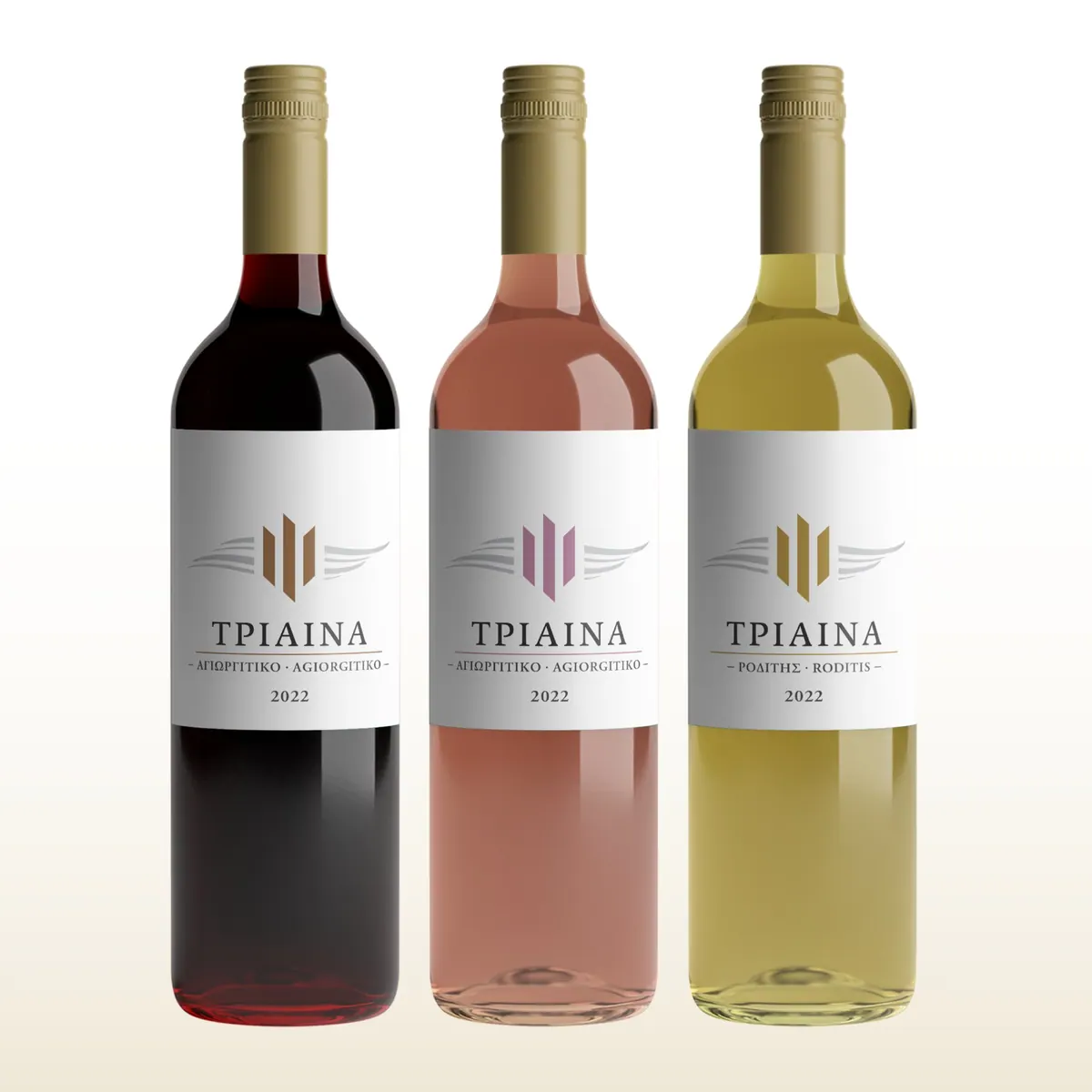 Three Triaina bottles, red, rosé and white, with the range label